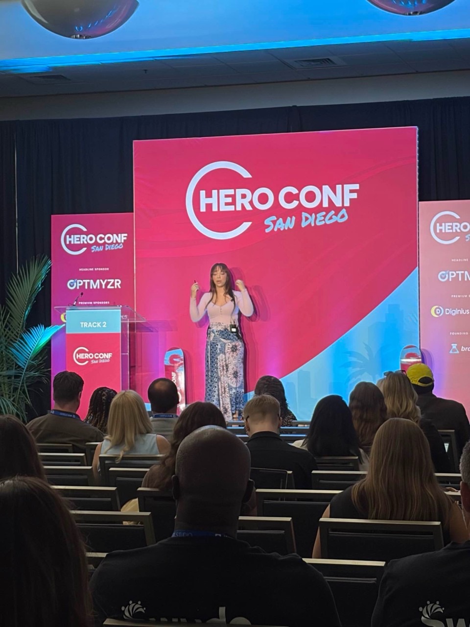Dii Pooler speaking on stage at HeroConf San Diego 2026